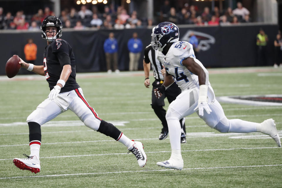 Atlanta Falcons quarterback Matt Ryan (2) works against Tennessee Titans inside linebacker Rashaan Evans (54) during the first half of an NFL football game, Sunday, Sept. 29, 2019, in Atlanta. (AP Photo/John Bazemore)