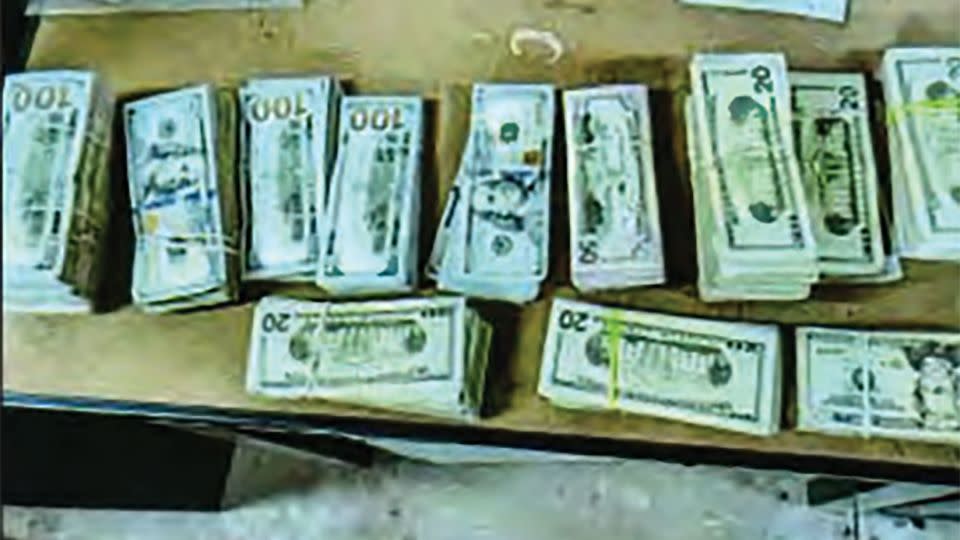 Photos of the stacks of cash delivered by an unidentified woman to the home of Juror #52 were included in an FBI affidavit in a federal case targeting the defrauding of federal child nutrition programs. - United States District Court