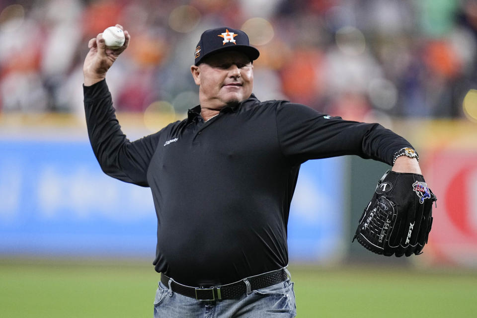 FILE - Former Houston Astros player Roger Clemens throws out a ceremonial pitch ahead of Game 1 of baseball's American League Championship Series between the Houston Astros and the New York Yankees, Wednesday, Oct. 19, 2022, in Houston. Steroids-tainted stars Barry Bonds, Roger Clemens and Rafael Palmeiro are on the eight-man ballot for the Hall of Fame’s contemporary baseball era committee, which meets Sept. 4 in San Diego. (AP Photo/Kevin M. Cox, File)