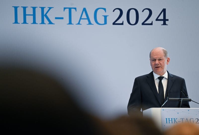 German Chancellor Olaf Scholz speaks during the IHK Day at the Haus der Deutschen Wirtschaft. The meeting of the German Chambers of Industry and Commerce will focus on topics including training, further education and the immigration of skilled workers. Sebastian Christoph Gollnow/dpa