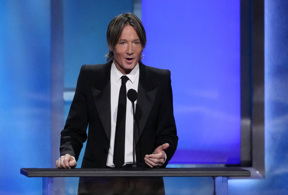 Keith Urban speaks from the stage during the 49th AFI Life Achievement Award tribute to his wife Nicole Kidman, Saturday, April 27, 2024, at the Dolby Theatre in Los Angeles. (AP Photo/Chris Pizzello)