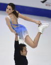 Evelyn Walsh and Trennt Michaud of Canada perform in the pair's free skating program during the ISU Four Continents Figure Skating Championships in Tallinn, Estonia, Saturday, Jan. 22, 2022. (AP Photo/Sergei Stepanov)