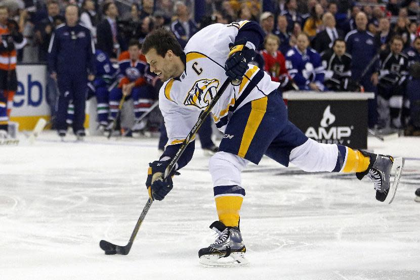 Nashville Predators Shea Weber, of Team Toews, takes a slap shot measured at 108.5 mph to win the hardest shot competition during the NHL All-Star hockey skills competition in Columbus, Ohio, Saturday, Jan. 24, 2015. (AP Photo/Gene J. Puskar)