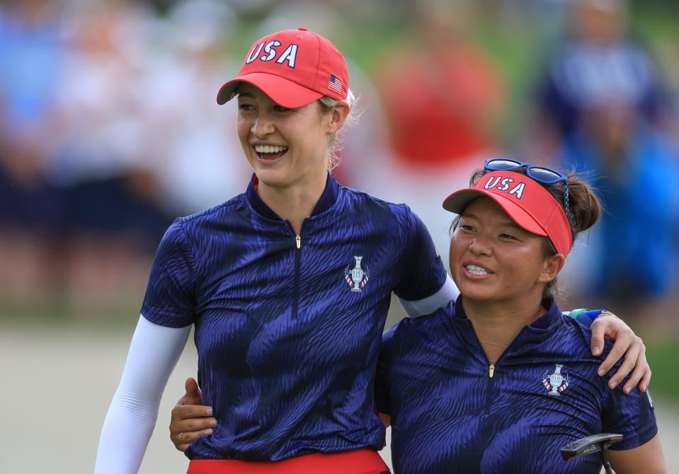 GAINESVILLE, VIRGINIA - SEPTEMBER 13: Megan Khang (R) and Nelly Korda of The United States Team celebrate as they leave the 14th green after winning their match by 6&4 against Georgia Hall and Leona Maguire of The European Team during the afternoon four ball matches of the Solheim Cup 2024 at Robert Trent Jones Golf Club on September 13, 2024 in Gainesville, Virginia. (Photo by David Cannon/Getty Images)