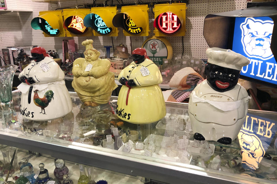 Coin banks featuring Black men and women with exaggerated features are for sale at Exit 76 Antique Mall in Edinburgh, Indiana, Tuesday, July 21, 2020. U.S. Rep. Greg Pence, the older brother Vice President Mike Pence, is being criticized for allowing the sale of objects with racist depictions of African Americans at the mall the congressman owns with his wife. (AP Photo/Casey Smith)