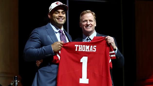 Thomas receives his first 49ers jersey. Pic: Getty