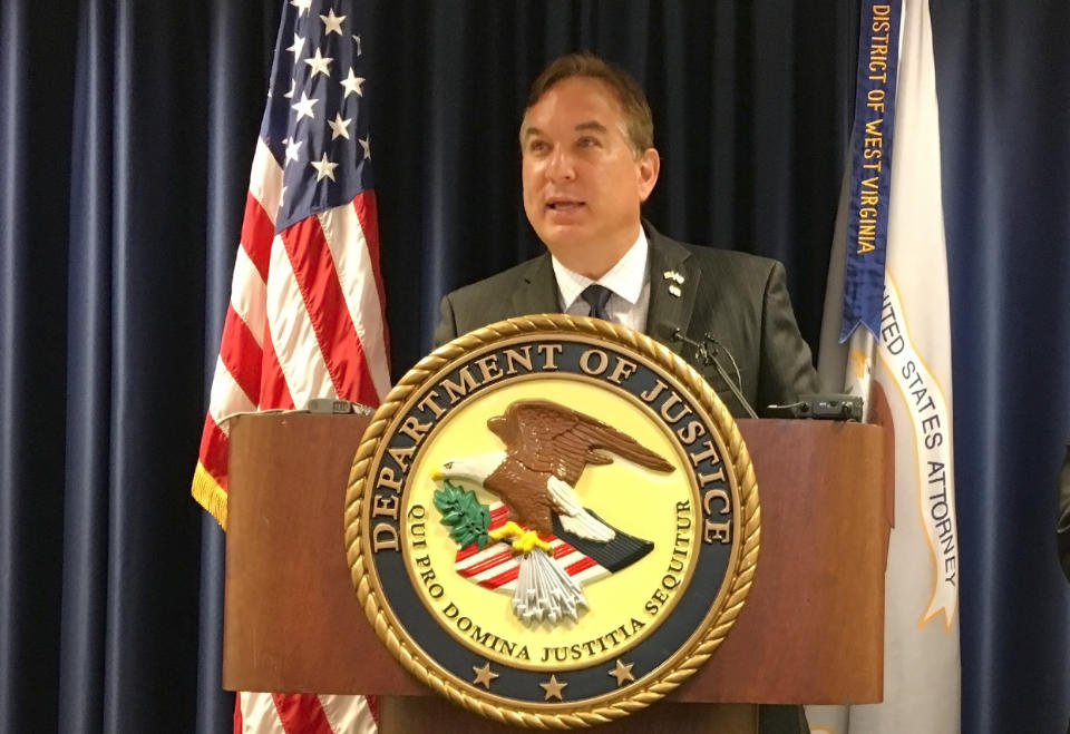 U.S. Attorney Mike Stuart speaks at a news conference, Wednesday, July 31, 2018, at the federal courthouse in Charleston, W.Va. Stuart announced that retired West Virginia Supreme Court Justice Menis Ketchum has agreed to plead guilty to a felony as part of an ongoing investigation of the state’s high court. (AP Photo/John Raby)