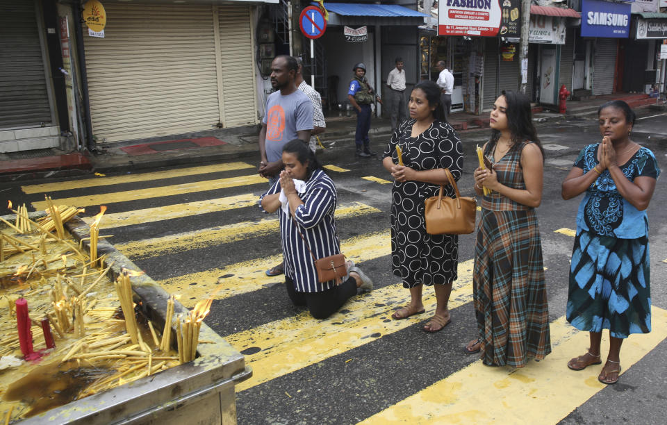 Sri Lankans light candles and pray outside St. Anthony's Church in Colombo, Sri Lanka, Tuesday, April 30, 2019. Sri Lanka is limping back to normalcy after the devastating bomb attacks on Easter Sunday that killed more than 250 people, meanwhile the archbishop said that the government's security operations to apprehend Islamic extremists who may be at large is unsatisfactory despite assurances from leaders. (AP Photo/Manish Swarup)