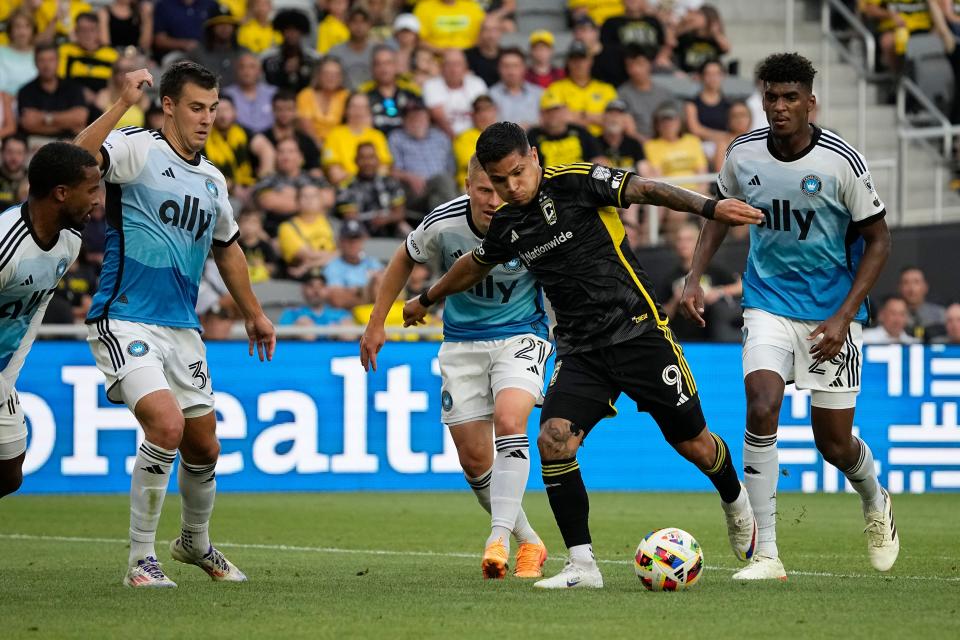 Jul 17, 2024; Columbus, OH, USA; Columbus Crew forward Cucho Hernandez (9) dribbles between Charlotte FC defender Nathan Byrne (14), midfielder Andrew Privett (34), defender Jere Uronen (21) and defender Adilson Malanda (29) during the first half of the MLS soccer game at Lower.com Field.