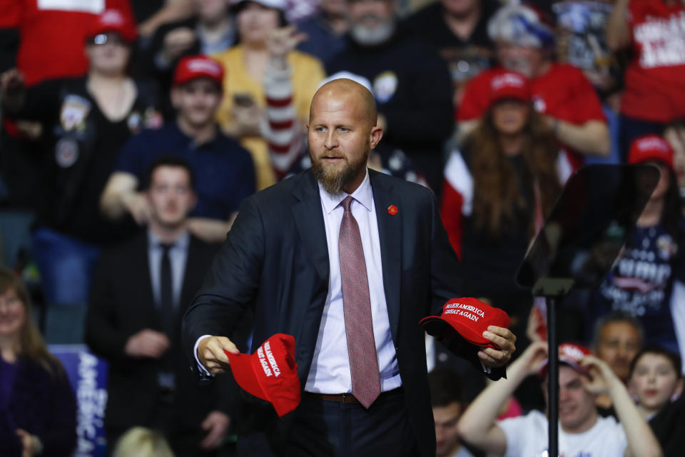 FILE - In this Thursday, March 28, 2019, file photo, Brad Parscale, manager of President Donald Trump's reelection campaign, throws "Make America Great Again," hats to the audience before a rally in Grand Rapids, Mich. Trump is shaking up his campaign amid sinking poll numbers, replacing Parscale with veteran GOP operative Bill Stepien. Trump and Parscale’s relationship had been strained since a Tulsa, Okla., rally that drew a dismal crowd, infuriating the president. (AP Photo/Paul Sancya, File)