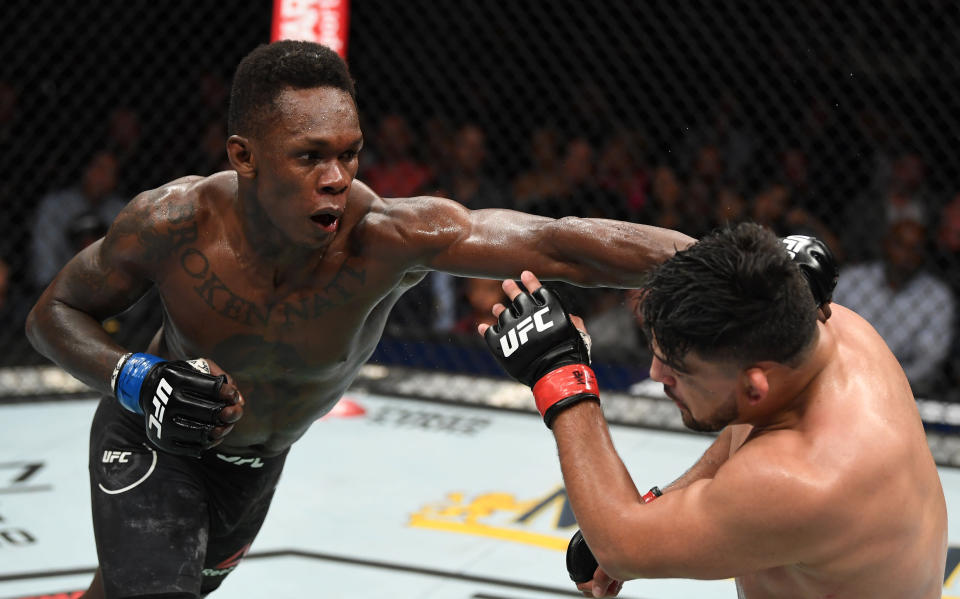 ATLANTA, GA - APRIL 13:  (L-R) Israel Adesanya punches Kelvin Gastelum in their interim middleweight championship bout during the UFC 236 event at State Farm Arena on April 13, 2019 in Atlanta, Georgia. (Photo by Josh Hedges/Zuffa LLC/Zuffa LLC via Getty Images)