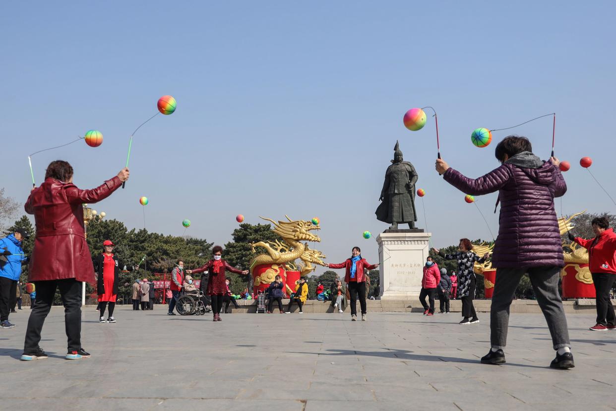 This photo taken on April 6, 2020, shows residents playing at a park in Shenyang in China's northeastern Liaoning province. China on April 7 reported no new COVID-19 coronavirus deaths for the first time since it started publishing figures in January, the National Health Commission said.