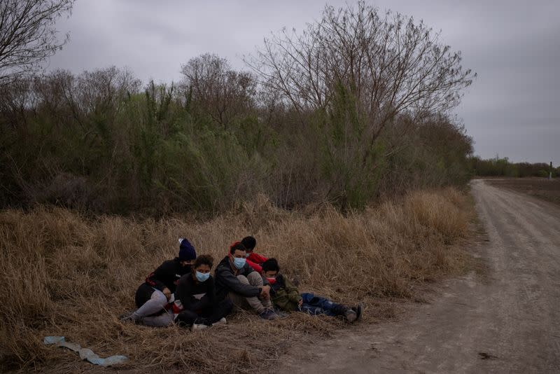 FILE PHOTO: Migrants from Central America are separated from other migrants by U.S. Border Patrol agents after crossing into the U.S. from Mexico on a raft in Penitas