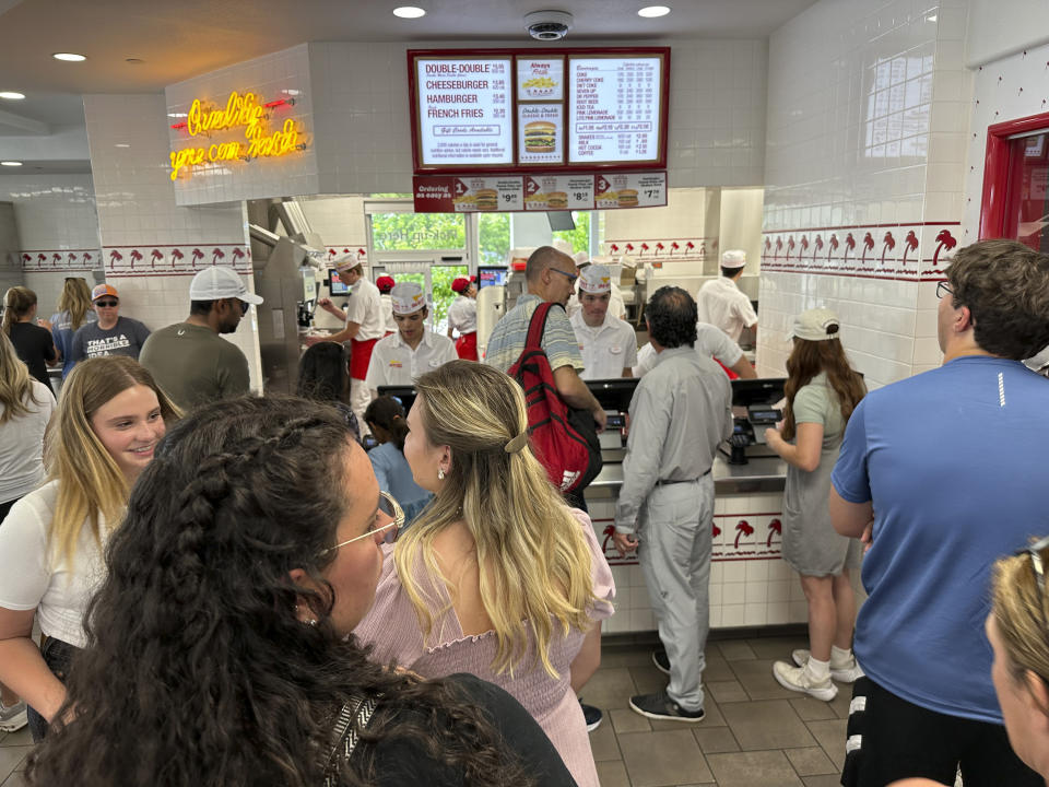 Customers queue up to order at an In-N-Out restaurant Sunday, June 2, 2024, in Lone Tree, Colo. On Wednesday, June 12, 2024, the Labor Department issues its report on prices at the consumer level in May. (AP Photo/David Zalubowski)