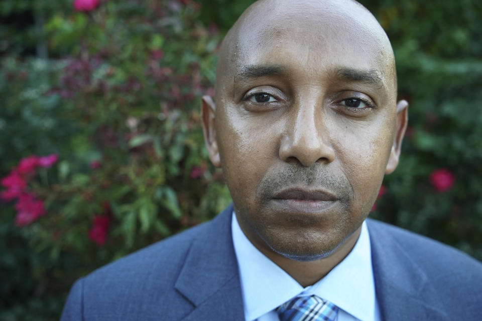 Tewodrose Tirfe poses for a portrait in front of his home in Harrisburg, N.C., on Thursday, Oct. 21, 2021. His group, the Amhara Association of America, is trying to find out how many Amhara have been killed in the war which erupted in November 2020 in Ethiopia’s Tigray region. (AP Photo/Allen G. Breed)