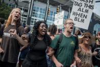 <p>Demonstrators protest outside of Bank of America Stadium before an NFL football game between the Charlotte Panthers and the Minnesota Vikings September 25, 2016 in Charlotte, North Carolina. Protests have disrupted the city since Tuesday night following the shooting of 43-year-old Keith Lamont Scott at an apartment complex near UNC Charlotte. (Photo by Sean Rayford/Getty Images) </p>