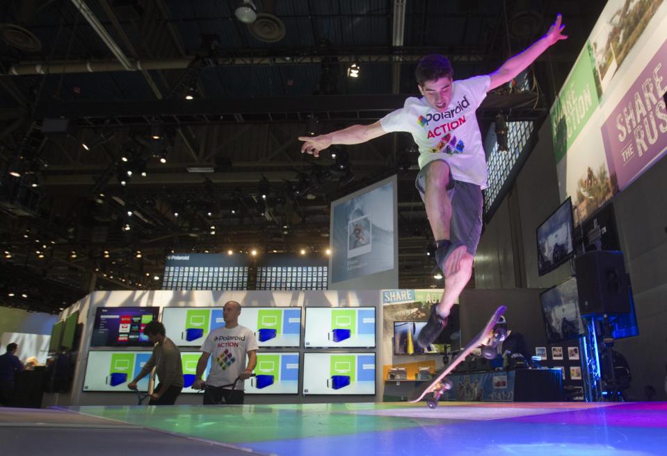 Skateboarder Peter Betti, 18, a member of the Polaroid Action team, performs at the Polaroid booth during the 2014 International Consumer Electronics Show (CES) in Las Vegas