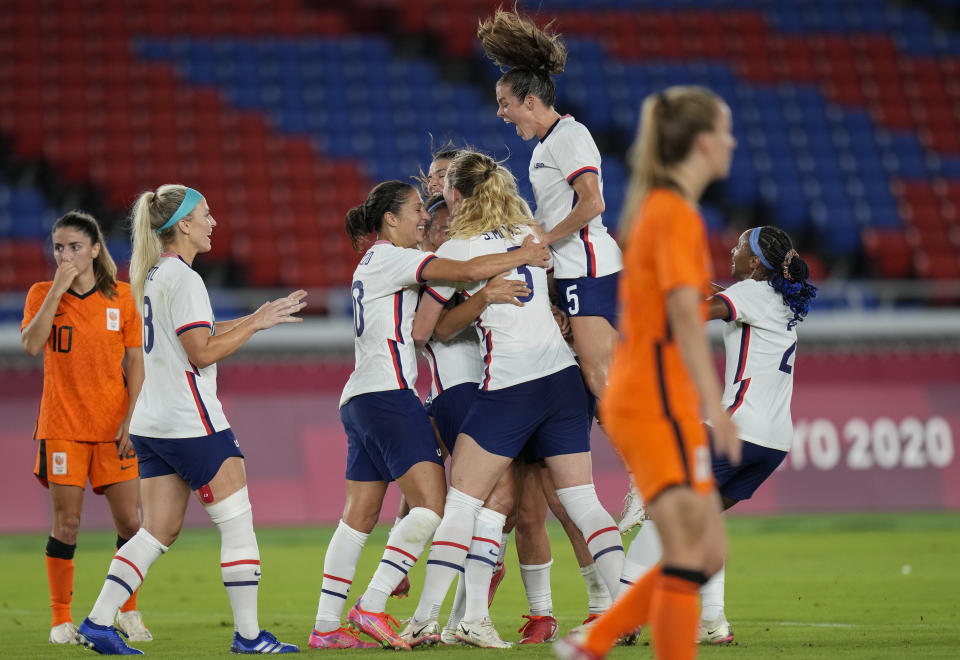 United States' players celebrate a goal scored by teammate Lynn Williams during a women's quarterfinal soccer match against Netherlands at the 2020 Summer Olympics, Friday, July 30, 2021, in Yokohama, Japan. (AP Photo/Silvia Izquierdo)