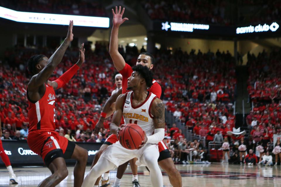 Iowa State's Tyrese Hunter (11) looks for an opening against Texas Tech during Tuesday's game in Lubbock.