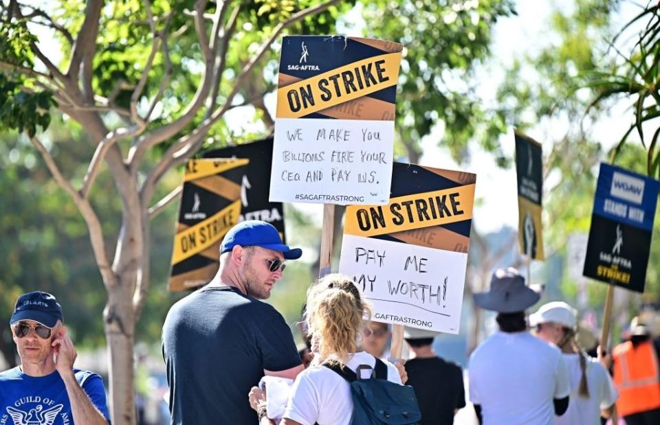 People with their signs