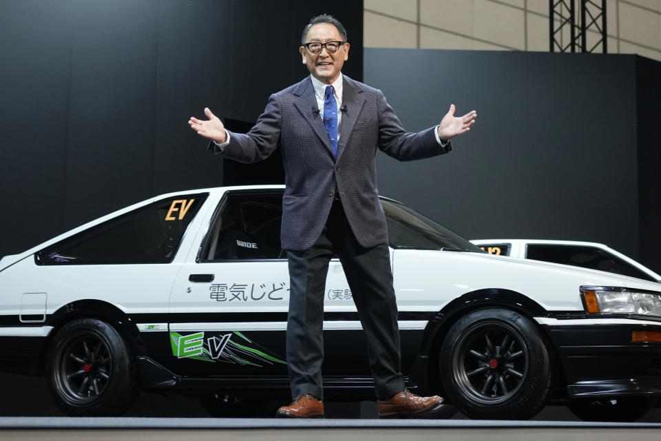 Toyota Motor Corp. Chief Executive Akio Toyoda delivers a speech on the stage at the Tokyo Auto Salon, an industry event similar to the world's auto shows Friday, Jan. 13, 2023, in Chiba near Tokyo. (AP Photo/Eugene Hoshiko)