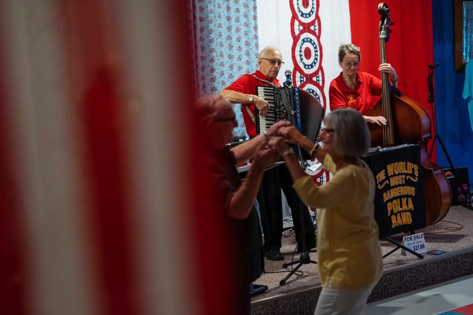Jim Enrietti, center, of Delton, plays the accordion as his wife, Teri Enrietti, of Delton, plays the bass as part of The World's Most Dangerous Polka Band during a weekly polka dance held at the South Range Eagles Club in South Range on Sunday, July 23, 2023, in Michigan's Upper Peninsula.
