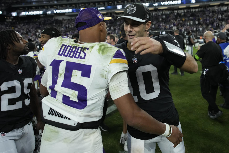 Las Vegas Raiders quarterback Jimmy Garoppolo (10) embraces Minnesota Vikings quarterback Joshua Dobbs (15) after an NFL football game, Sunday, Dec. 10, 2023, in Las Vegas. (AP Photo/John Locher)