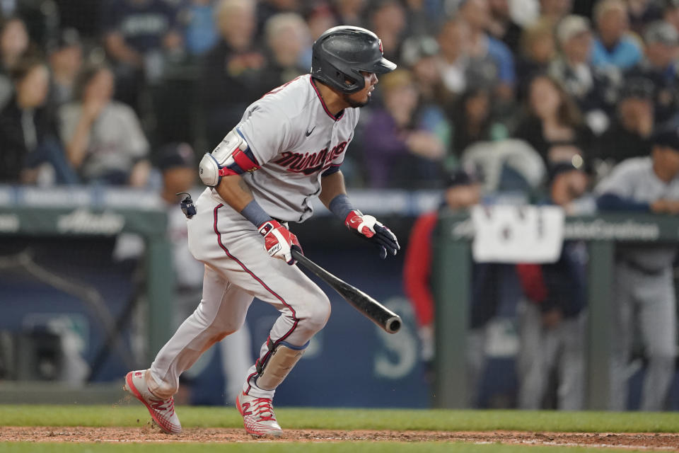 Minnesota Twins' Luis Arraez watches his two-run single during the eighth inning of the team's baseball game against the Seattle Mariners, Wednesday, June 15, 2022, in Seattle. (AP Photo/Ted S. Warren)