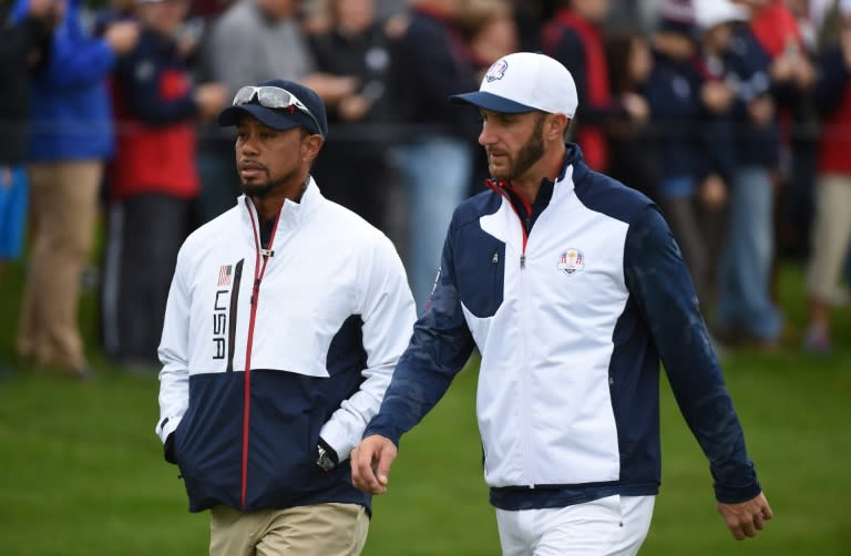 Team USA's Dustin Johnson and vice-captain Tiger Woods walk during a practice round ahead of the 41st Ryder Cup at Hazeltine National Golf Course