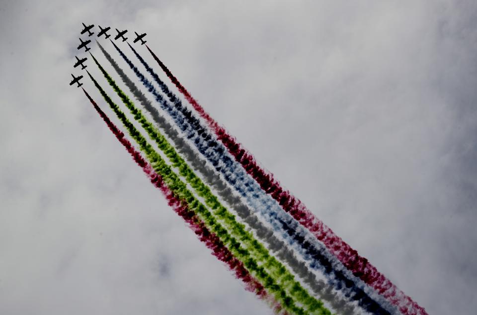 Al Fursan, or the Knights, a UAE Air Force aerobatic display team, perform during the opening day of the International Defence Exhibition & Conference, IDEX, in Abu Dhabi, United Arab Emirates, Sunday, Feb. 21, 2021. (AP Photo/Kamran Jebreili)