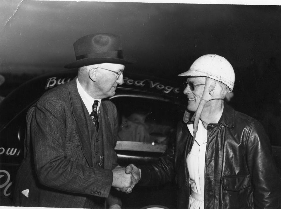 Cannonball Baker (left) congratulates Red Byron after Byron won the 1948 race at Daytona.