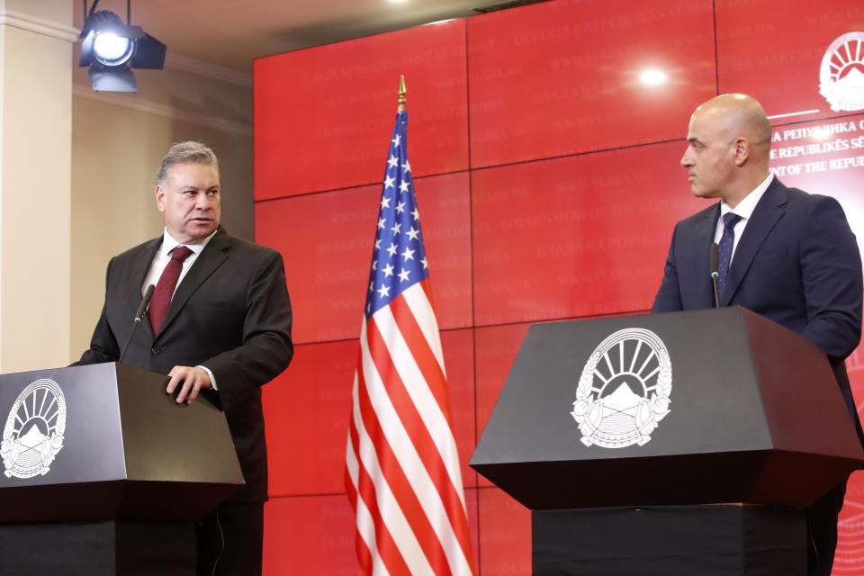 Gabriel Escobar, U.S. Deputy Assistant of the State for Balkan policy, left and North Macedonia's Prime Minister Dimitar Kovacevski, right, attend a joint news conference at the Government building in Skopje, North Macedonia, on Friday, Aug. 25. 2023. The senior State Department official on Friday voiced hope that North Macedonia will be able to approve politically difficult changes to the constitution that would help its bid to join the European Union. (AP Photo/Boris Grdanoski)