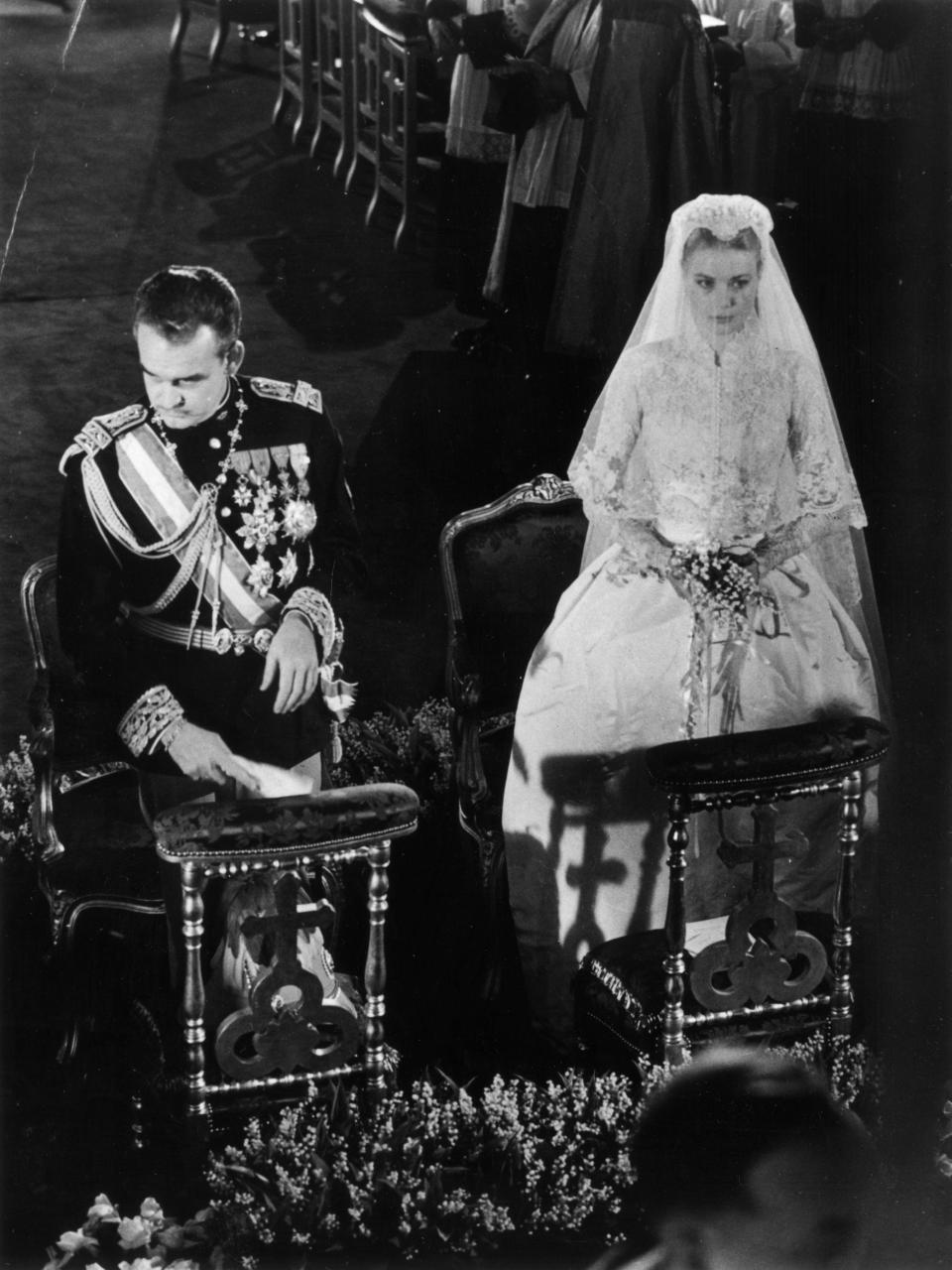 Prince Rainier of Monaco with his bride, Grace Kelly, during their wedding service in Monaco Cathedral.