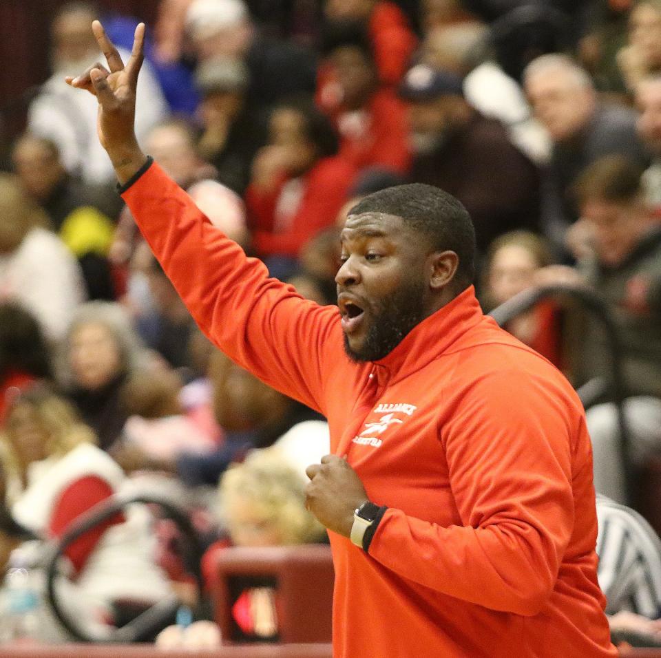 Alliance head coach Sean Weatherspoon signals to his team against Youngstown Chaney in a district semifinal Thursday, March 2, 2023, at Boardman High School.