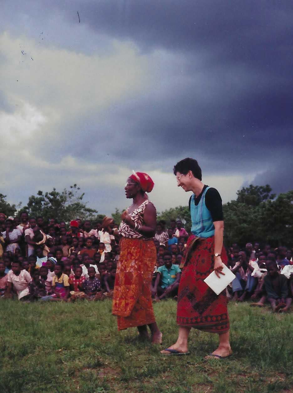 Then-Peace Corps volunteer Valerie Fronczak, right, giving a thank-you speech while speaking Chichewa -- a Bantu language that is an official national language of Malawi along with English -- after she completed her pre-service training. The woman next to her is translating the speech for English-speaking staff. Fronczak served in the Peace Corps from 1989 to 1991.