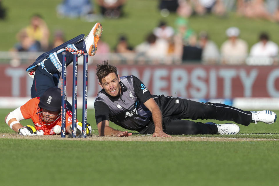 New Zealand's Tim Southee, right, tries to run out England's Jonny Bairstow during the T20 cricket match between England and New Zealand in Napier, New Zealand, Friday, Nov. 8, 2019. (John Cowpland/Photosport via AP)