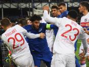 Everton fan appears to throw punch at Lyon player while holding child during fight triggered by Ashley Williams tackle