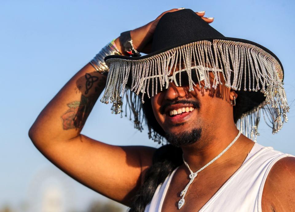 Christian Torres of Pasadena poses for a photo on his way into the Coachella Valley Music and Arts Festival in Indio, Calif., Saturday, April 16, 2022.