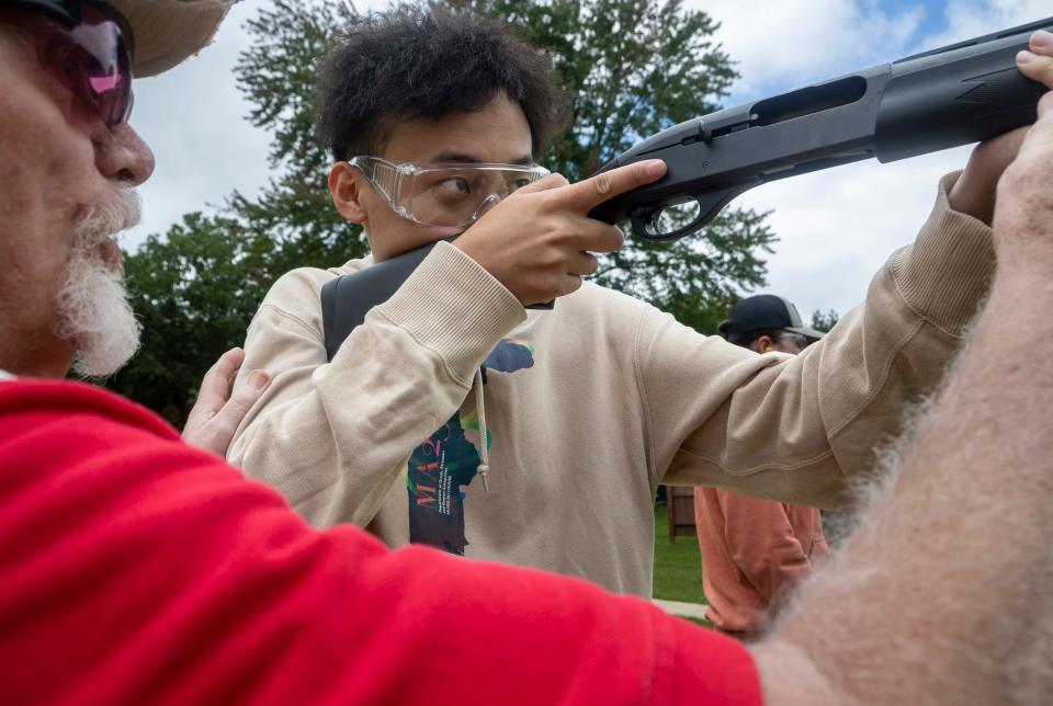 Yifei Jiang, a transfer student at the University of Michigan, prepares to shoot a clay target during a Hunter Safety Field Day at the Washtenaw Sportsman's Club in Ypsilanti on Saturday, Sept. 9, 2023.