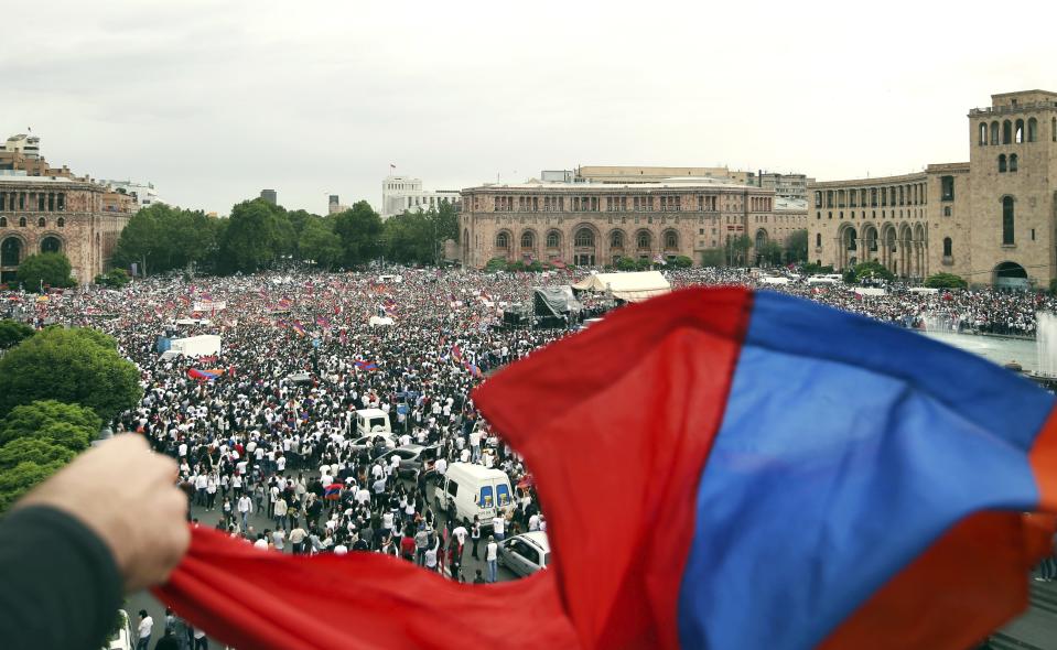 FILE - In this file photo taken on Tuesday, May 8, 2018, supporters of opposition lawmaker Nikol Pashinian gather in Republic Square in Yerevan, Armenia. Armenians are set to cast ballots in parliamentary elections expected to cement the incumbent prime minister's grip on power. (AP Photo/Thanassis Stavrakis, File)