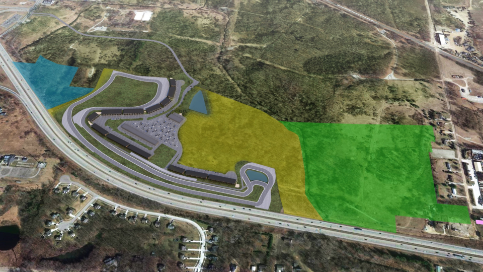 A rendering shows an aerial view of plans for Motorsports Gateway Howell, including a driving circuit and garage condos along the track. Future phases include extending the driving circuit to the area in yellow, an auto innovation business park in green, and a mixed-use entertainment and commercial zone, in blue.