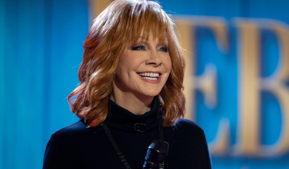 Reba McEntire smiling on stage