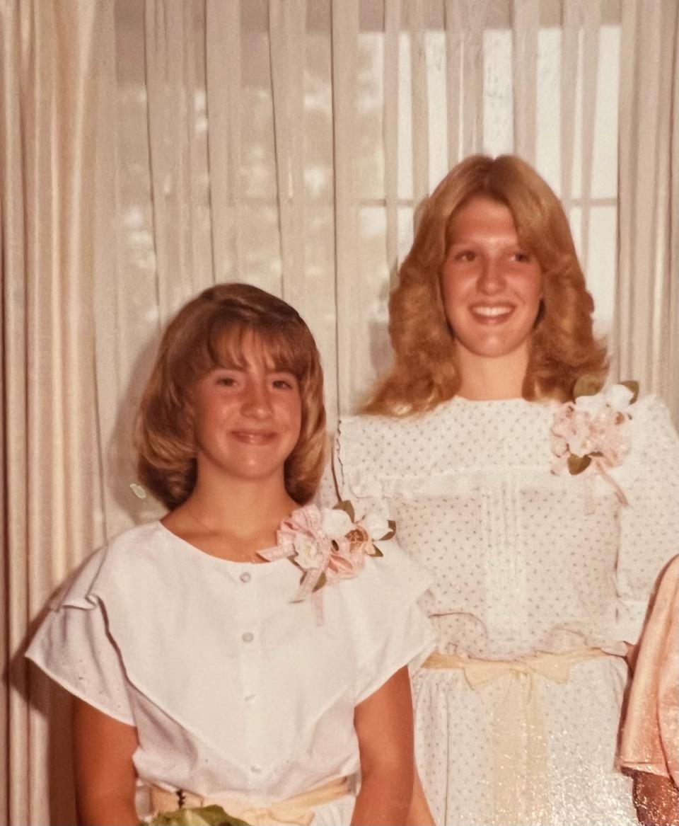 Cindy Clemishire (L) is pictured at the age of 12 with her sister.