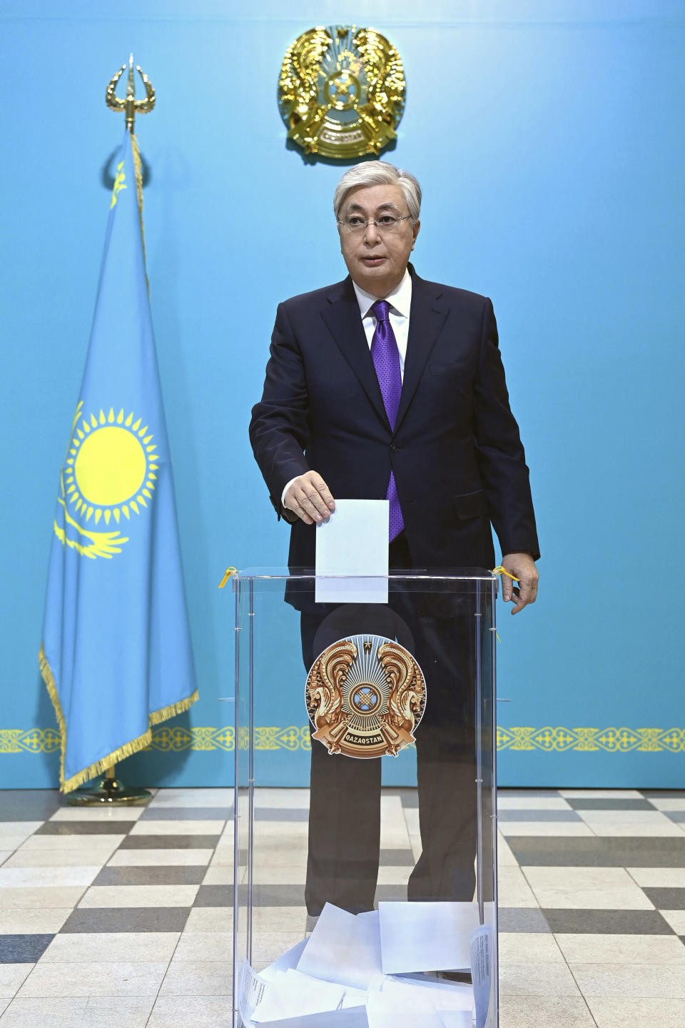 In this handout photo released by Kazakhstan's President Press Office, Kazakhstan's President Kassym-Jomart Tokayev casts his ballot at a polling station in Astana, Kazakhstan, Sunday, Nov. 20, 2022. Tokayev appears certain to win a new term against little-known challengers in a snap election on Sunday. Five candidates are on the ballot against President Kassym-Jomart Tokayev, who faced a bloody outburst of unrest early this year and then moved to marginalize some of the Central Asian country's longtime powerful figures. (Kazakhstan's President Press Office via AP)