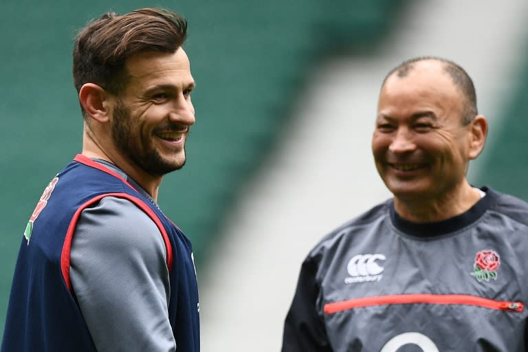 England's coach Eddie Jones (R) and scrum-half Danny Care attend a training session at Twickenham stadium in London, on March 10, 2017