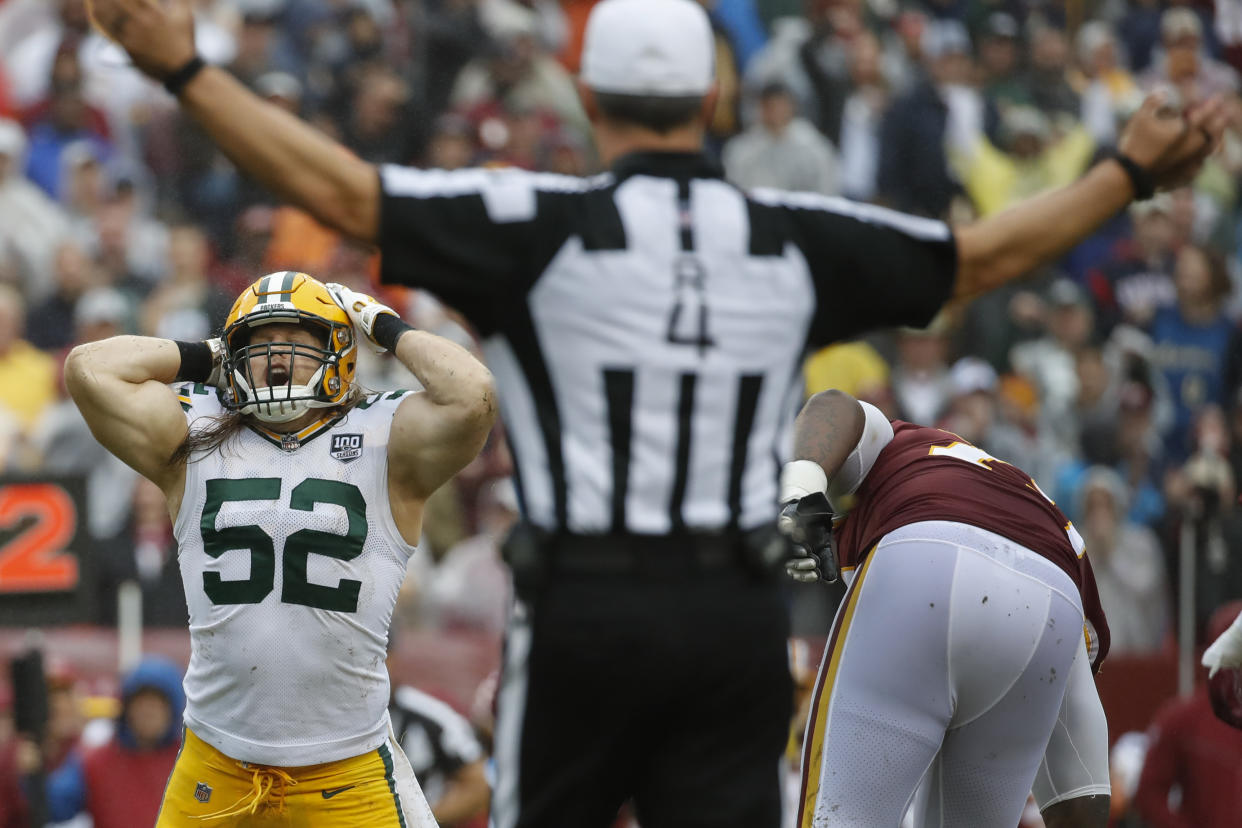 Packers linebacker Clay Matthews reacts to his penalty after tackling Redskins quarterback Alex Smith on Sunday, his third roughing the passer penalty of the season. (AP)