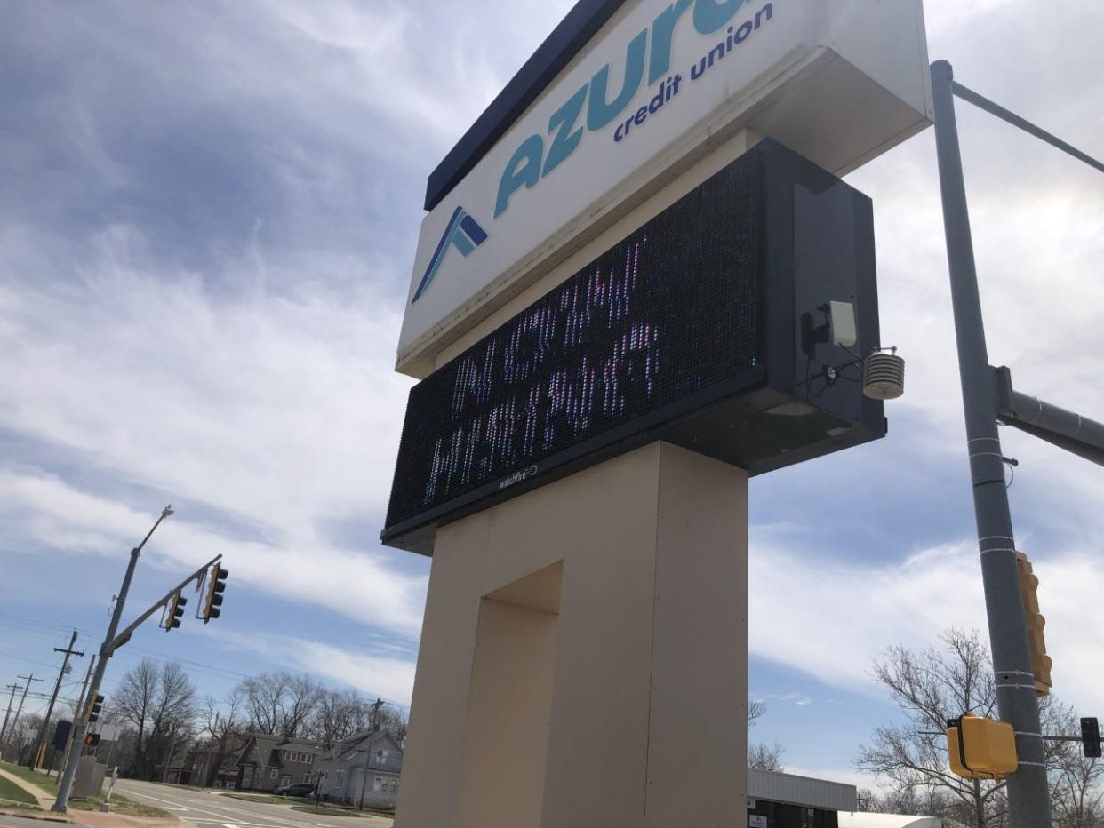 Azura Credit Union, 1129 S. Kansas Ave., flashes its "help wanted" sign in bold lettering.