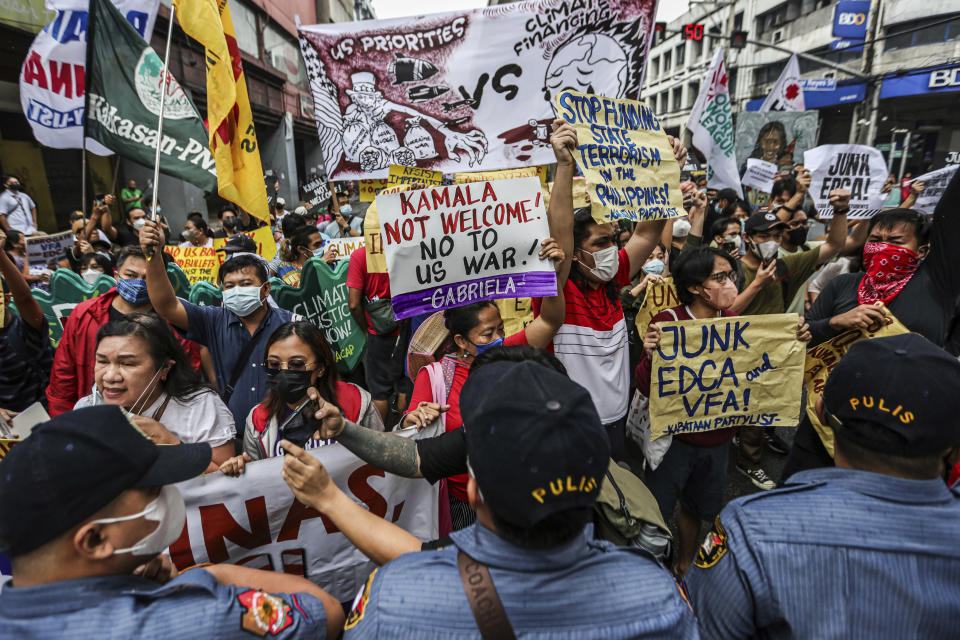 Protesters hold a rally as they tried to march near Malacanang Palace against the visit of U.S. Vice President Kamala Harris in Manila Monday, Nov. 21. 2022. (AP Photo/Gerard V. Carreon)