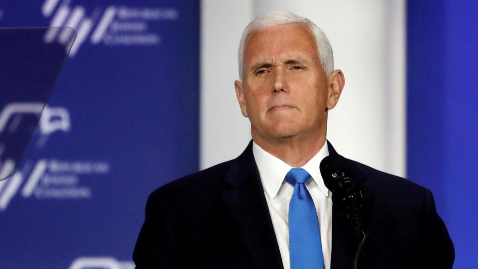 PHOTO: Former U.S. Vice President Mike Pence stands at the podium after announcing he will discontinue his presidential campaign, during the Republican Jewish Coalition Annual Leadership Summit in Las Vegas, Nevada, Oct. 28, 2023. (Steve Marcus/Reuters)