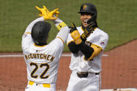Pittsburgh Pirates' Connor Joe, right, celebrates with Andrew McCutchen (22) after hitting a three-run home run off Chicago Cubs starting pitcher Justin Steele during the third inning of a baseball game in Pittsburgh, Saturday, May 11, 2024. (AP Photo/Gene J. Puskar)